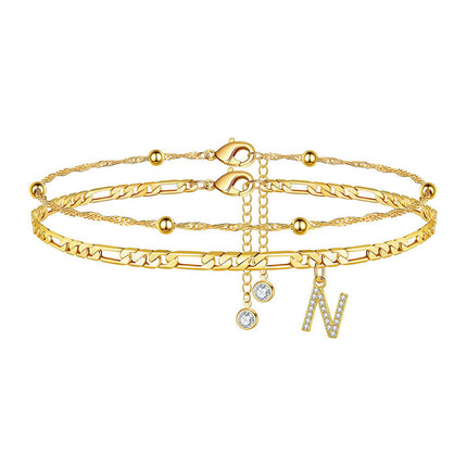 Simple unisex initial anklet featuring a decorated letter