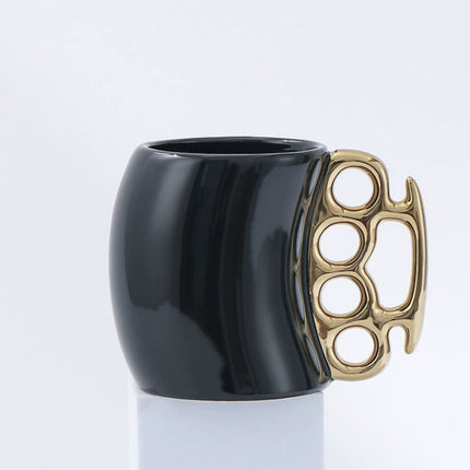 Novelty Brass Knuckle Coffee Mug – Ceramic Mug with Metallic Knuckle Handle – Unique Funny Gift for Christmas & Birthdays – 12oz Black/White Office Mug